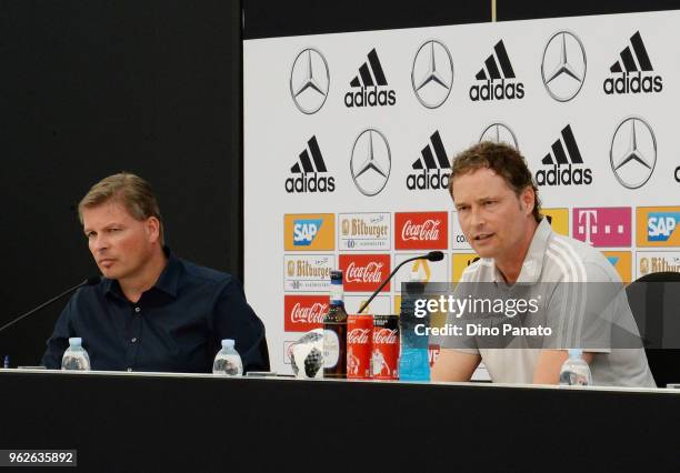 Germany's assistant coach Marcus Sorg speaks to the media at a press conference as Media Director Jens Grittner looks on during the Southern Tyrol...