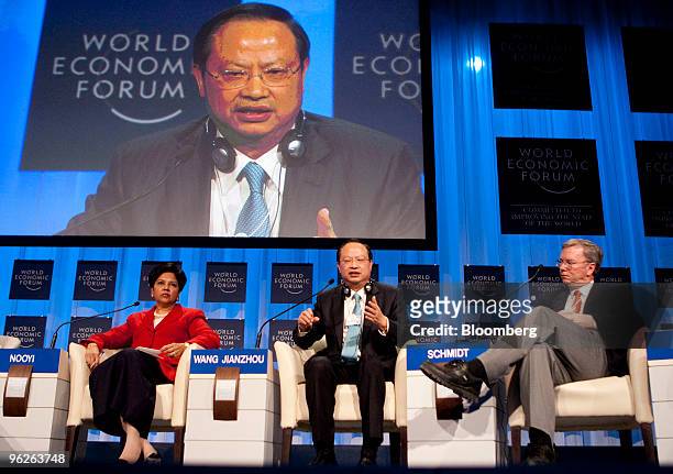 Indra Nooyi, chairman and chief executive officer of PepsiCo Inc., left, Wang Jianzhou, chairman of China Mobile Ltd., center, and Eric Schmidt,...