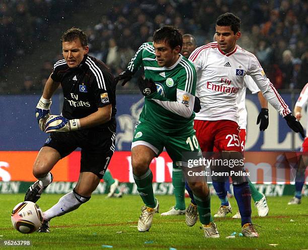 Tomas Rincon and Frank Rost of Hamburg and Zvjezdan Misimovic of Wolfsburg battle for the ball during the Bundesliga match between Hamburger SV and...