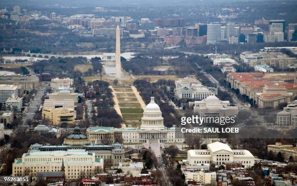 The skyline of Washington, DC, including the US Capitol building, Washington Monument, Lincoln Memorial and National Mall, is seen from the air,...