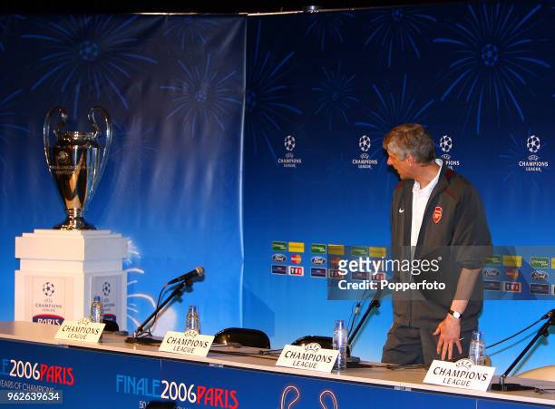 Arsenal manager Arsene Wenger looks at the European Cup during the Arsenal press conference prior to the UEFA Champions League Final between Arsenal...