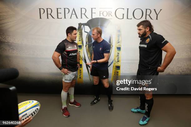 Opposing captains Brad Barritt of Saracens and Don Armand of Exeter Chiefs toss the coin under the watchful eye of referee Wayne Barnes prior to the...