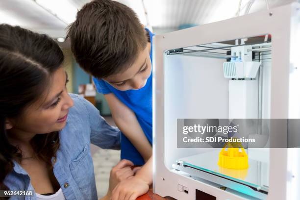 boy and his mom use 3d printer - 3d mom son stock pictures, royalty-free photos & images