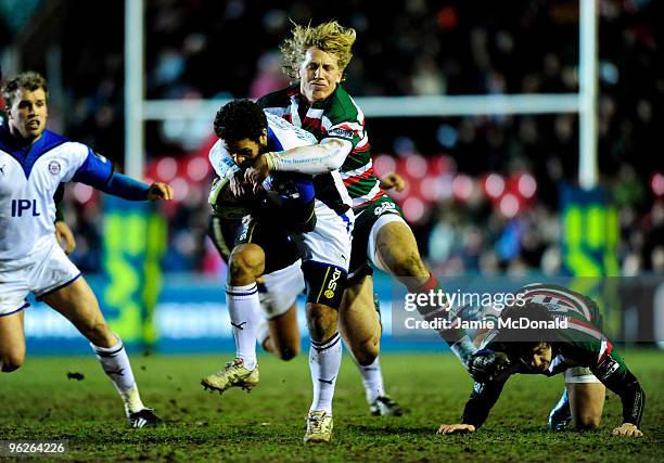 Joe Maddock of Bath is tackled by Billy Twelvetrees of Leicester Tigers during the LV Anglo Welsh Cup match between Leicester Tigers and Bath at...