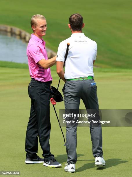 Alexander Bjork of Sweden and Markus Kinhult of Sweden shake hands on the 18th green during day three of the BMW PGA Championship at Wentworth on May...