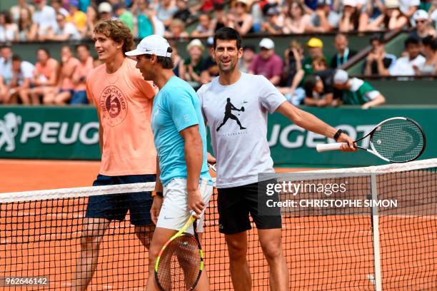 Germany's Alexander Zverev , Spain's Rafael Nadal and Serbia's Novak Djokovic smile during an exhibition game during 'Kids Day' on The Philippe...