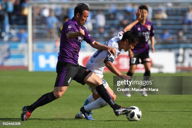 Marcus Tulio Tanaka of Kyoto Sanga and Bae Seung Jin of Yokohama FC compete for the ball during the J.League J2 match between Kyoto Sanga and...
