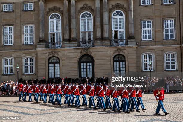The Royal Life Guard is marching on the Amalienborg Palace Square prior to Crown prince Frederik and family appear on the balcony of their residence...