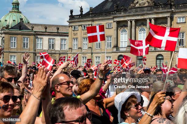Thousand of Danes and tourists with the flag Dannebrog on the Amalienborg Palace Square during Crown prince Frederik with his family appearance on...