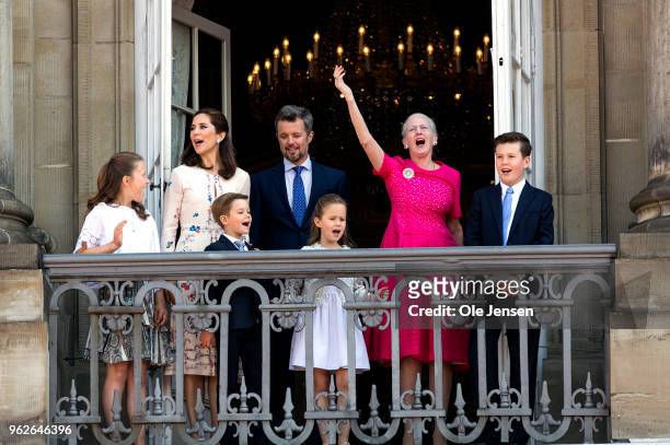 Queen Margrethe of Denmark leads the cheering for Crown Prince Frederik of Denmark /L- 3rd) on the Amalienborg Palace square on the occasion of his...