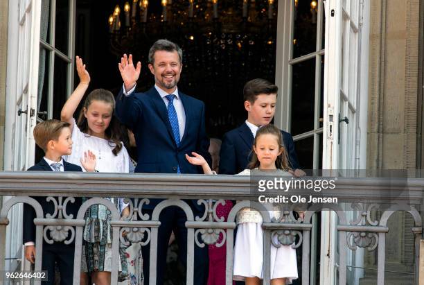 Crown Prince Frederik of Denmark with his children waves ro rhe people on the Amalienborg Palace square on the occasion of his 50th birthday on May...