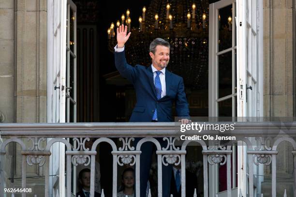 Crown Prince Frederik of Denmark waves ro rhe people on the Amalienborg Palace square on the occasion of his 50th birthday on May 26, 2018 in...