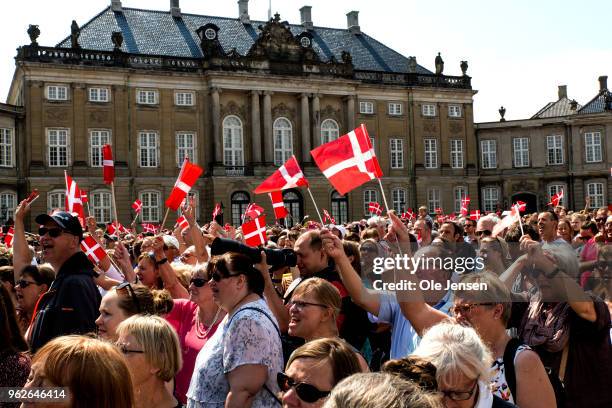 Thousand of Danes and tourists with the flag Dannebrog on the Amalienborg Palace Square during Crown prince Frederik with his family appearance on...