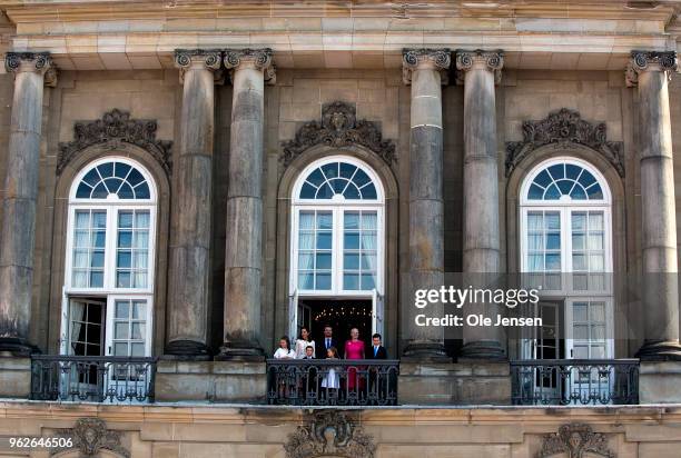 Crown Prince Frederik of Denmark with his family waves to the people on the Amalienborg Palace square on the occasion of his 50th birthday on May 26,...