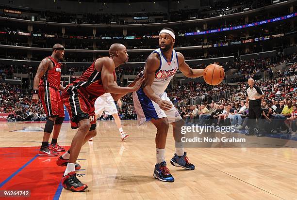 Baron Davis of the Los Angeles Clippers moves the ball against Rafer Alston of the Miami Heat during the game on January 10, 2010 at Staples Center...