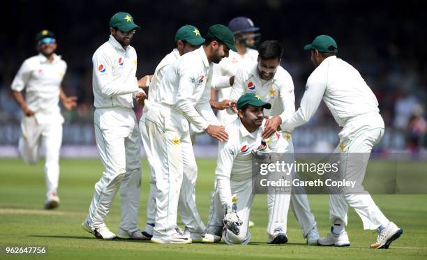 Mohammad Amir of Pakistan celebrates with captain Sarfraz Ahmed after dismissing Dawid Malan of England during day three of the 1st NatWest Test...