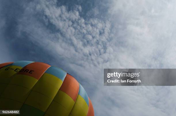 Hot air balloon is tethered to the ground after being inflated during the Durham Hot Air Balloon Festival on May 26, 2018 in Durham, England. Held in...