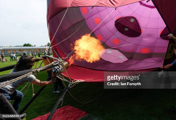 Hot air balloon is inflated during the Durham Hot Air Balloon Festival on May 26, 2018 in Durham, England. Held in the city for the second year the...