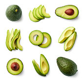 Set of fresh whole and sliced avocado