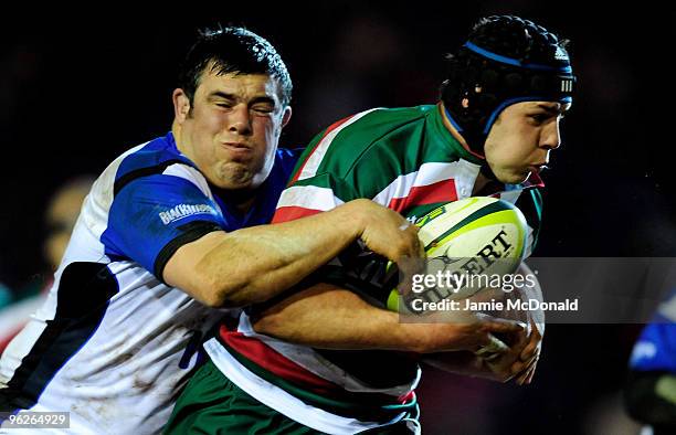 Ben Pienaar of Leicester Tigers is tackled by Duncan Bell of Bath during the LV Anglo Welsh Cup match between Leicester Tigers and Bath at Welford...