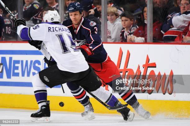 Defenseman Marc Methot of the Columbus Blue Jackets defends against forward Brad Richardson of the Los Angeles Kings on January 28, 2010 at...