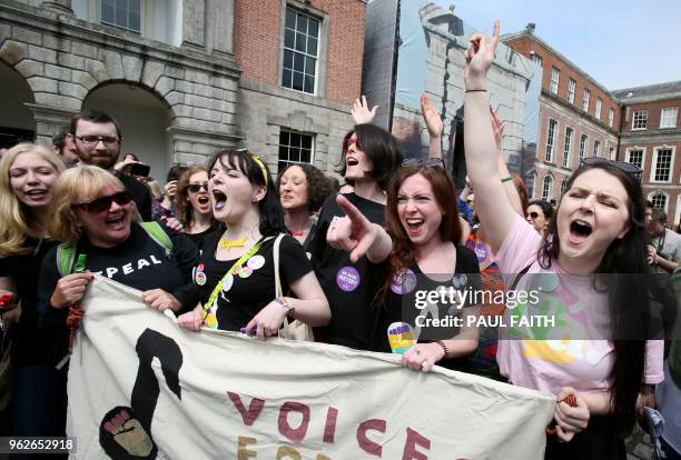 Yes campaigners jubilate as they wait for the official result of the Irish abortion referendum, at Dublin Castle in Dublin on May 26, 2018. - The...