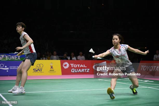 Yuki Fukushima and Sayaka Hirota of Japan compete against Jongkolphan Kititharakul and Puttita Supajirakul of Thailand during the Uber Cup Final...