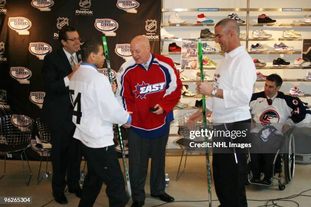 Deputy Commissioner Bill Daly shakes hands with Tim Jones of the 2010 US Paralympic Sled Hockey Team at the NHL Powered by Reebok store in Midtown...