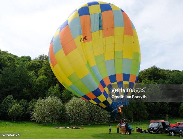 Balloon envelope is blown by wind as it is tethered to the ground during the Durham Hot Air Balloon Festival on May 26, 2018 in Durham, England. Held...
