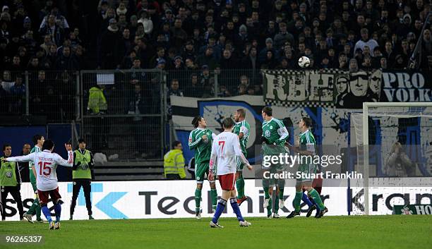 Piotr Trochowski of Hamburg scores the equalizing goal from a free kick against a wall of players from Wolfsburg during the Bundesliga match between...