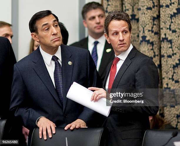 Timothy Geithner, U.S. Treasury secretary, right, speaks with Representative Darrell Issa, a Republican from California, before a hearing of the...