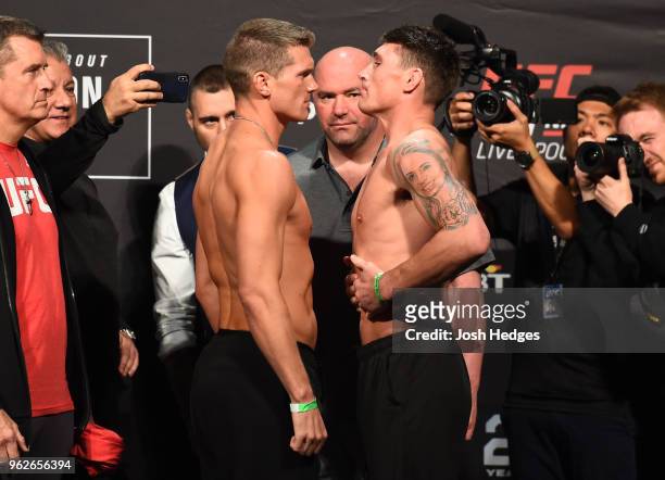 Opponents Stephen Thompson and Darren Till of England face off during the UFC Weigh-in at ECHO Arena on May 26, 2018 in Liverpool, England.