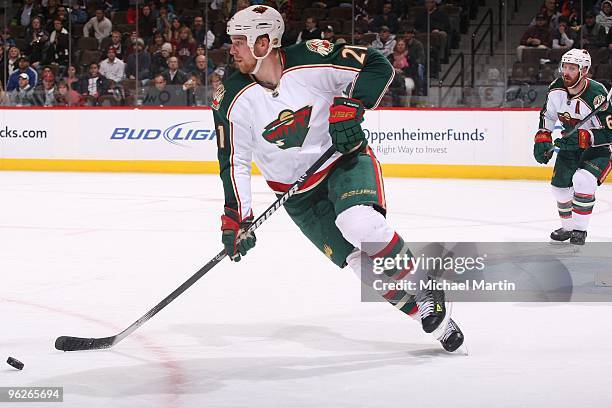 Kyle Brodziak of the Minnesota Wild skates against the Colorado Avalanche at the Pepsi Center on January 28, 2010 in Denver, Colorado. The Wild...