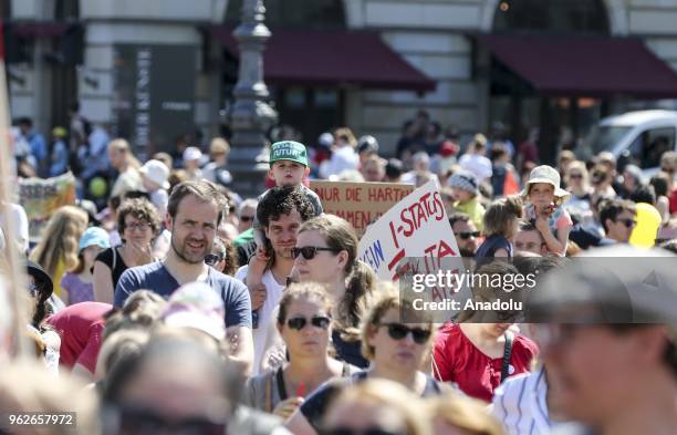 Parents and teachers march from the Unter den Linden street to Pariser Platz Square as they gather to stage a protest against lack of the vacancy at...
