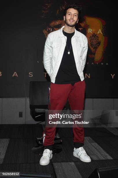 Sebastian Yatra poses for photos during a press conference as part of the presentation of the album "Mantra" at Universal Music on May 24, 2018 in...