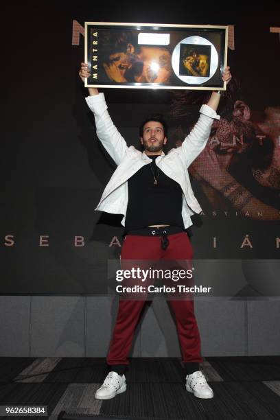 Sebastian Yatra poses for photos during a press conference as part of the presentation of the album "Mantra" at Universal Music on May 24, 2018 in...