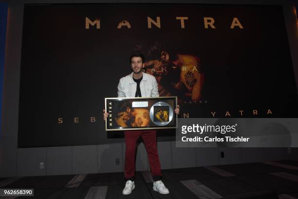Sebastian Yatra poses for photos during a press conference as part of the presentation of the album "Mantra" at Universal Music on May 24, 2018 in...