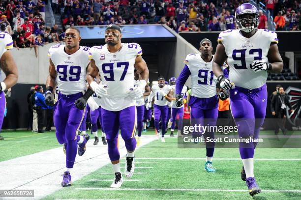 Stephen Weatherly of the Minnesota Vikings runs out on the field against the Atlanta Falcons at Mercedes-Benz Stadium on December 3, 2017 in Atlanta,...