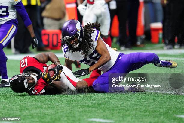 Mohamed Sanu of the Atlanta Falcons is tackled by Trae Waynes of the Minnesota Vikings at Mercedes-Benz Stadium on December 3, 2017 in Atlanta,...