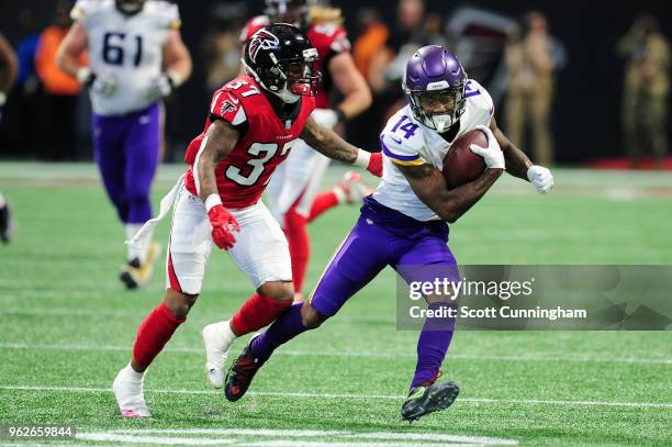 Stefon Diggs of the Minnesota Vikings runs after a catch against the Atlanta Falcons at Mercedes-Benz Stadium on December 3, 2017 in Atlanta, Georgia.