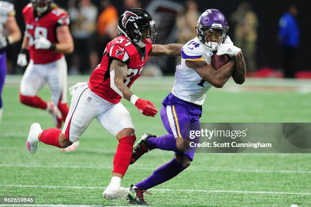 Stefon Diggs of the Minnesota Vikings runs after a catch against the Atlanta Falcons at Mercedes-Benz Stadium on December 3, 2017 in Atlanta, Georgia.