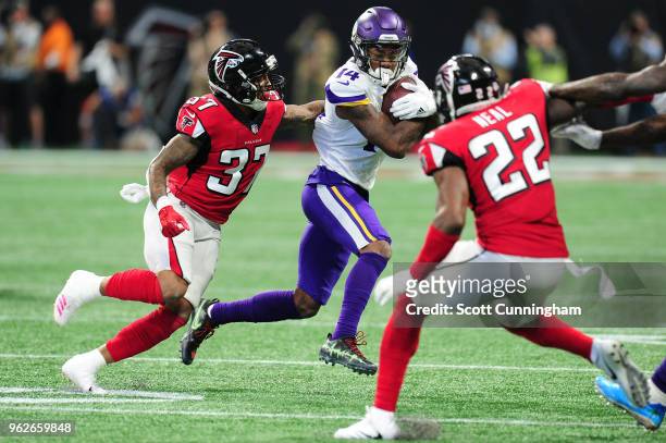 Stefon Diggs of the Minnesota Vikings runs after a catch against the Atlanta Falcons at Mercedes-Benz Stadium on December 3, 2017 in Atlanta, Georgia.