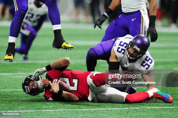 Matt Ryan of the Atlanta Falcons is tackled by Anthony Barr of the Minnesota Vikings at Mercedes-Benz Stadium on December 3, 2017 in Atlanta, Georgia.