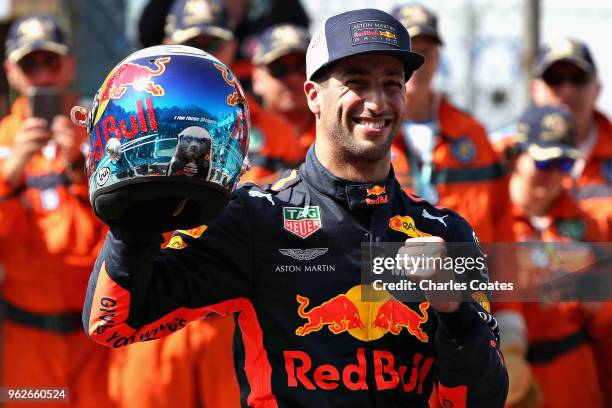 Pole position qualifier Daniel Ricciardo of Australia and Red Bull Racing celebrates in parc ferme during qualifying for the Monaco Formula One Grand...