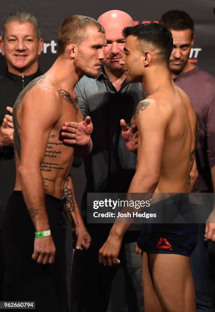 Opponents Jason Knight and Makwan Amirkhani of Kurdistan face off during the UFC Weigh-in at ECHO Arena on May 26, 2018 in Liverpool, England.