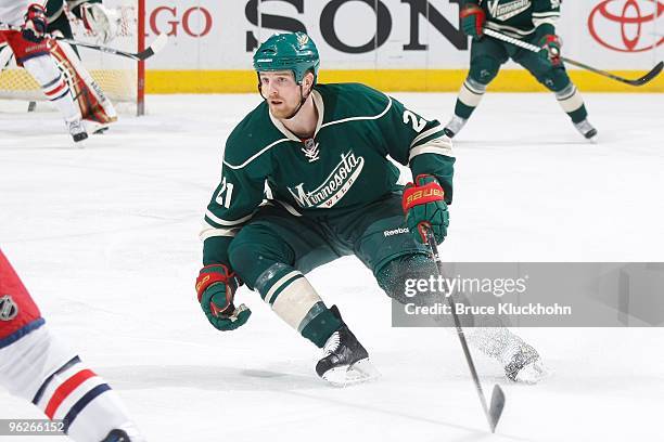 Kyle Brodziak of the Minnesota Wild defends against the Columbus Blue Jackets during the game at the Xcel Energy Center on January 23, 2010 in Saint...