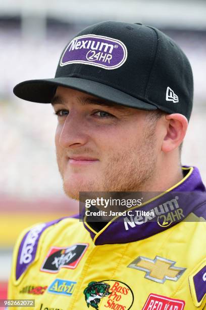 Ty Dillon, driver of the Nexium 24HR Chevrolet, stands by his car during qualifying for the NASCAR Xfinity Series ALSCO 300 at Charlotte Motor...