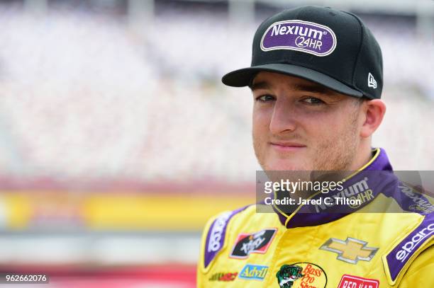 Ty Dillon, driver of the Nexium 24HR Chevrolet, stands by his car during qualifying for the NASCAR Xfinity Series ALSCO 300 at Charlotte Motor...