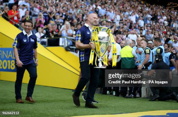 Lawrence Dallaglio and Rob Andrew deliver the trophy wearing Scotland shirts in support of Doddie Wear during the Aviva Premiership Final at...