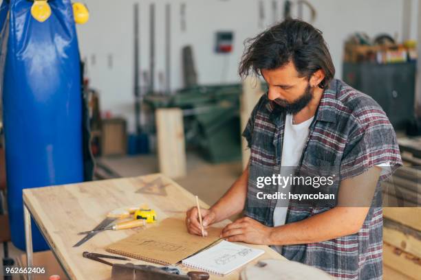carpenter at work - serrated knife stock pictures, royalty-free photos & images